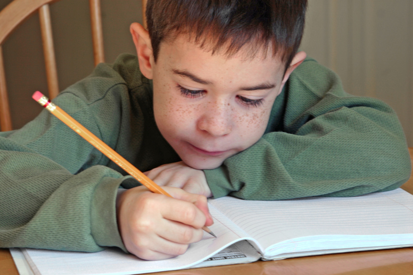 boy writing at Bexley City Schools