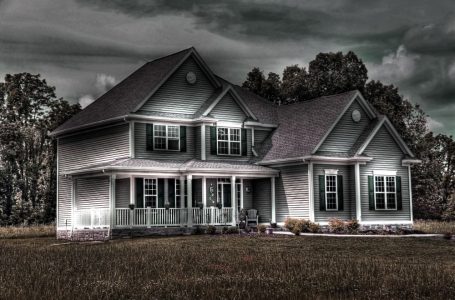 Haunted house under a ominous cloudy sky. Real Estate Fact: Ghost Disclosures