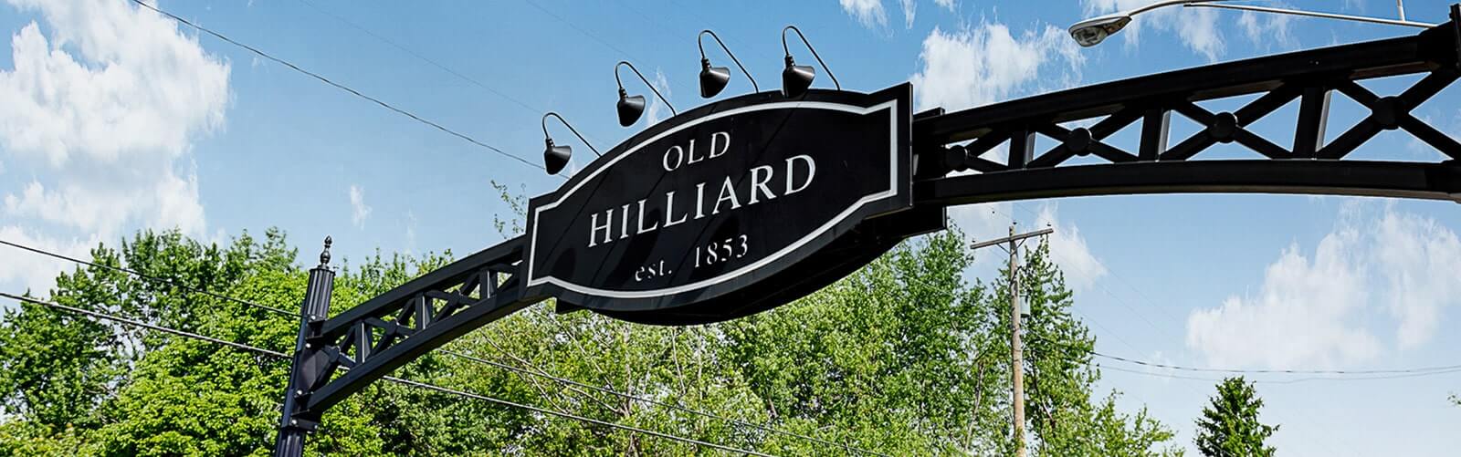 street sign with "Old Hilliard" in English script.