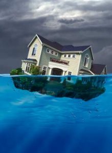 House sinking under water.