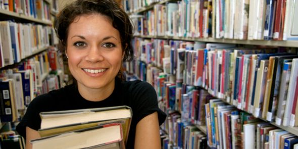 Girl standing in library
