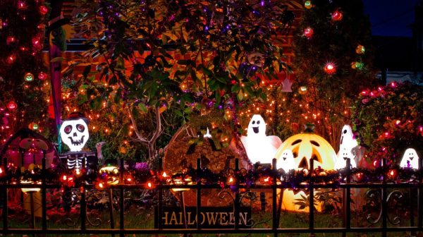 Outdoor Decorating for Halloween idea with lighted pumpkin, skeleton, and ghosts